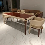 Upholstered-Leg Dining Table with Amber Burl Wood Top and Metal Accents